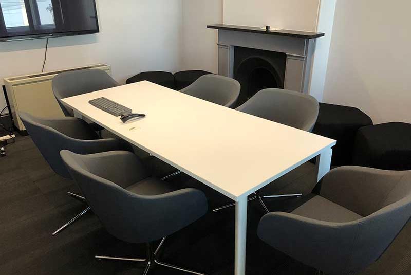 A small meeting room with table and chairs. 
