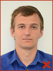 Example of unacceptable ID photo as subject has background shadow