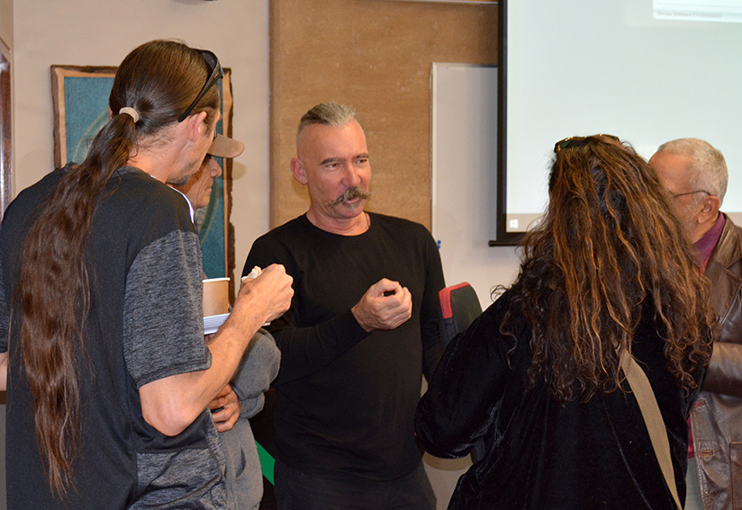 Dr Stephen Gapps talking with four audience members