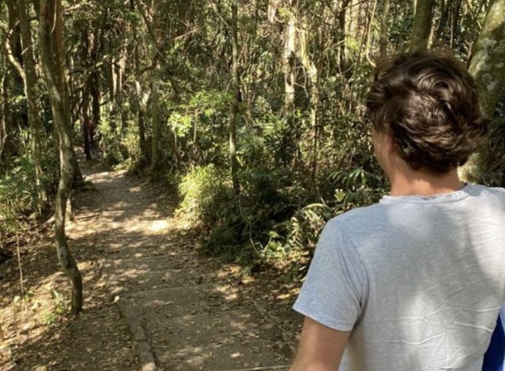 Student standing at top of walking track